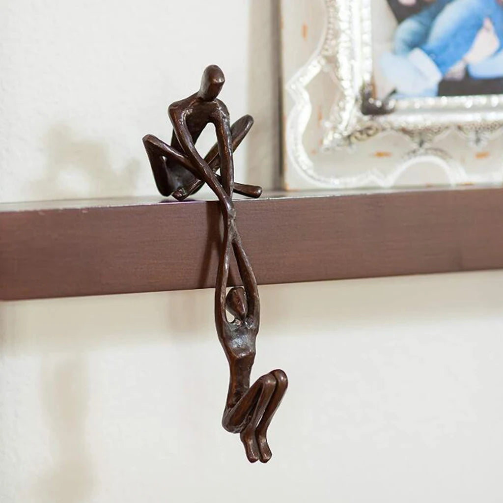 Man Lifting Woman Statue