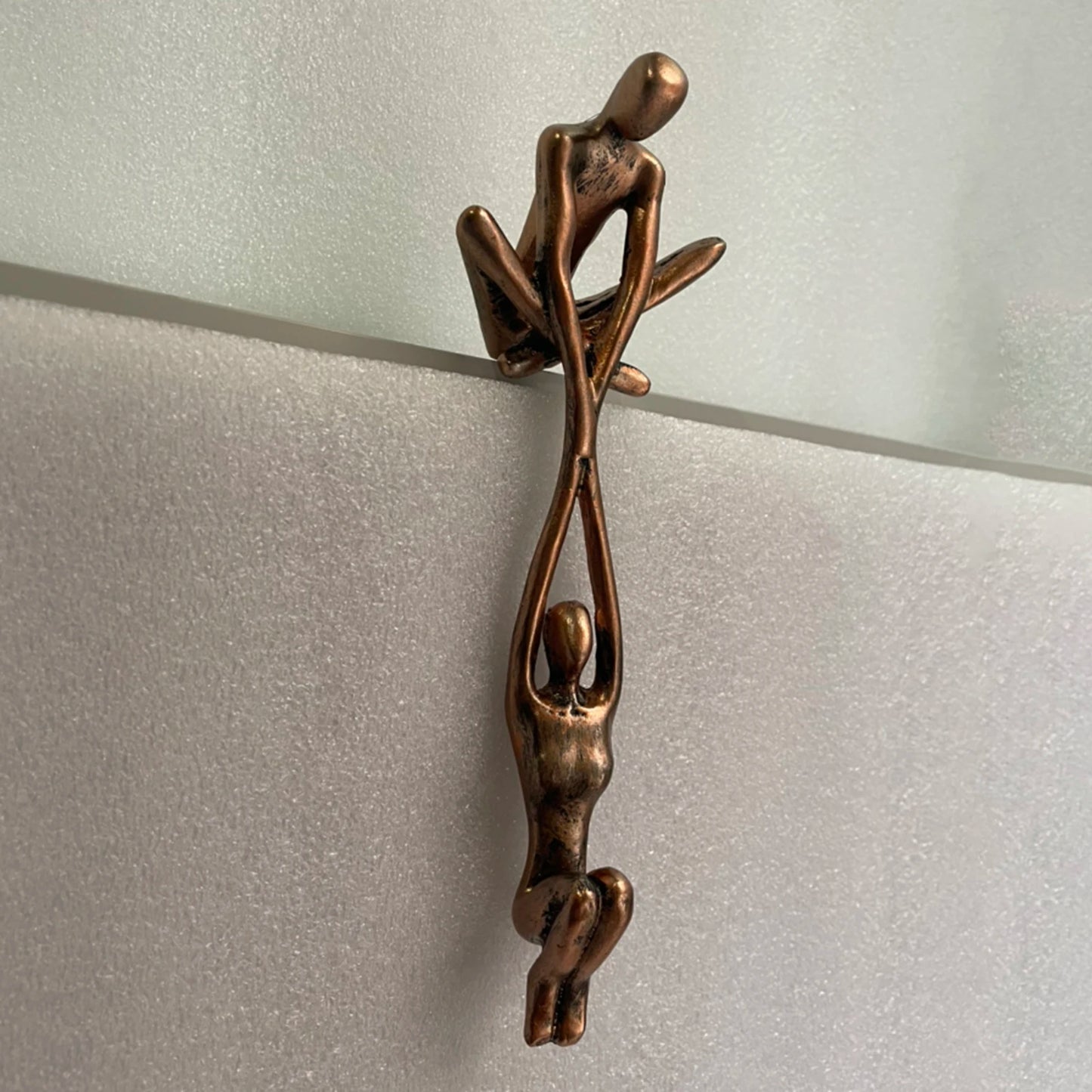 Man Lifting Woman Statue