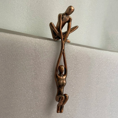 Man Lifting Woman Statue